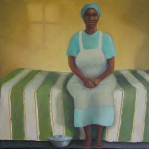 African woman sitting on bed