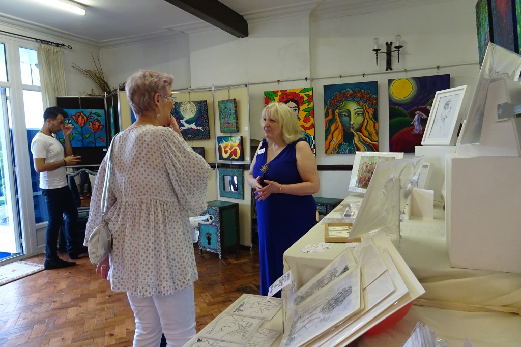 Melissa talking to a visitor