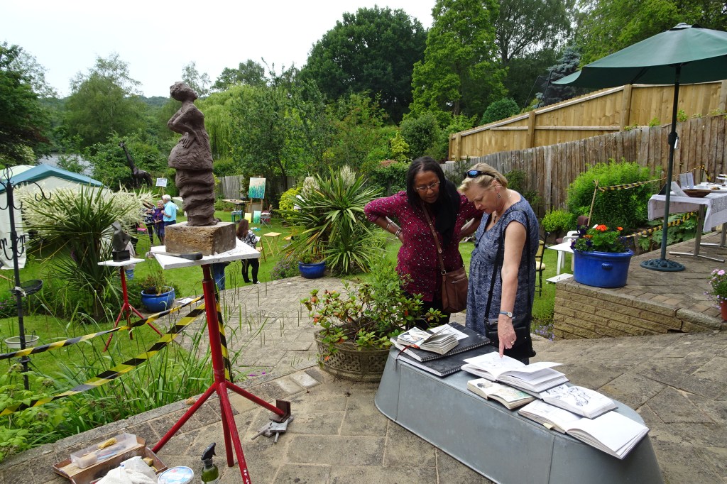 Looking at Petra's sketchbook, sculpture in progress