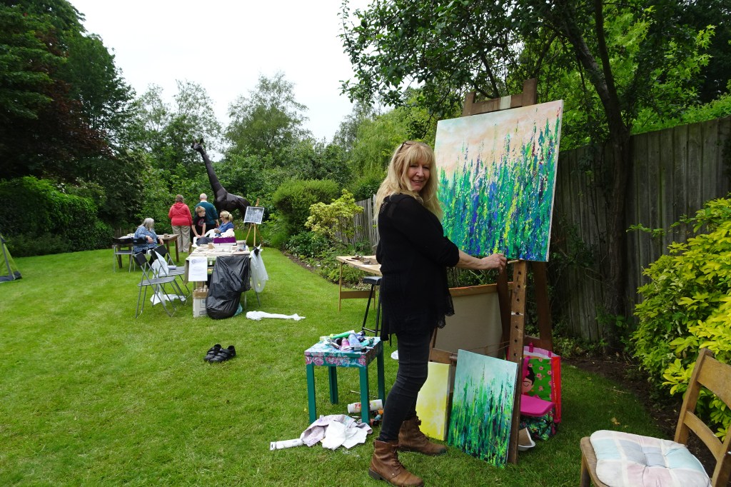 Gill painting all day Sunday in the garden